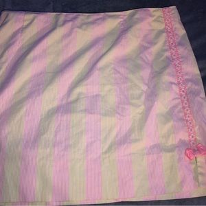 Pink, green and white skirt with a tiny pink bow and flowers  on the side